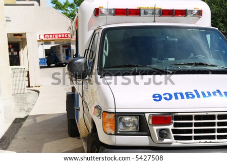 Ambulance vehicle in front of an emergency entrance to a hospital