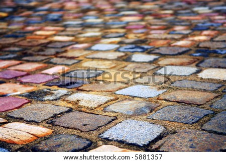 Background of colorful cobblestone pavement close up