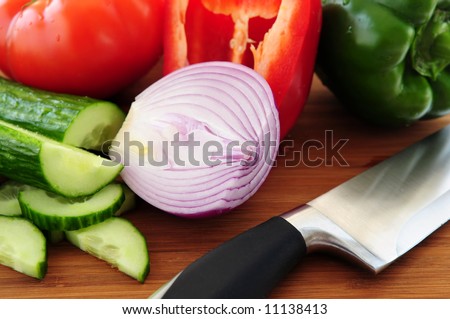 Fresh garden vegetables on cutting board - ingredients for a salad