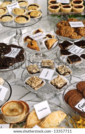Various desserts on display in bakery window