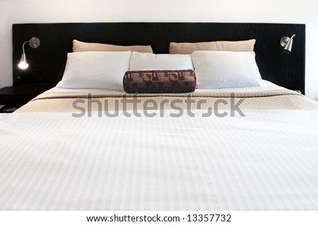 Comfortable bed in upscale hotel close up