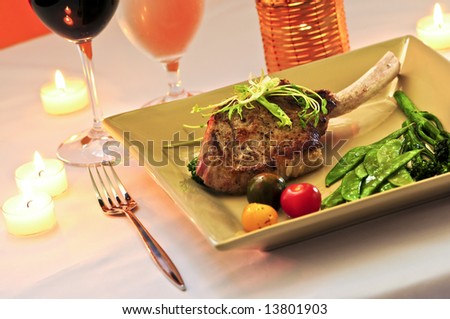 Gourmet romantic dinner with red wine at candlelight