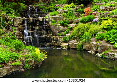 Cascading waterfall and pond in japanese garden