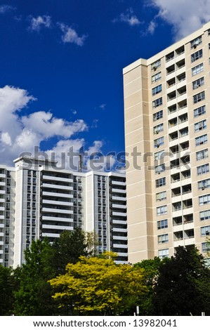Tall residential apartment buildings with blue sky