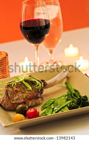 Gourmet romantic dinner with red wine at candlelight