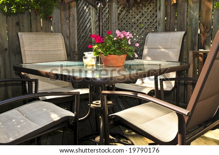 Wooden deck of a house with patio furniture