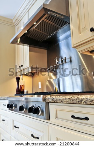 Interior of modern luxury kitchen with stainless steel appliances