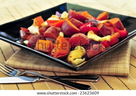 Vegetarian dish of roasted yams with cheese and peppers