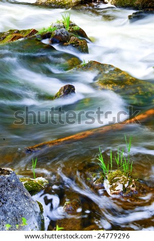 Water rushing among rocks in river rapids in Ontario Canada