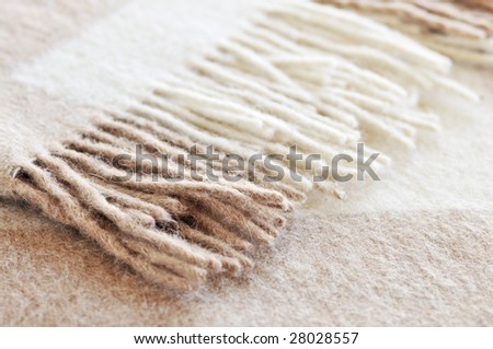 Soft and warm folded alpaca wool blanket with fringe