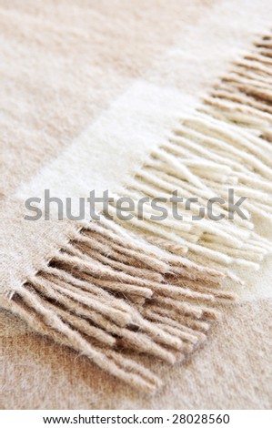 Soft and warm folded alpaca wool blanket with fringe