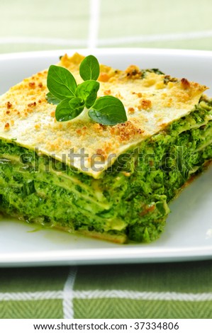 Serving of fresh baked vegetarian spinach lasagna on a plate