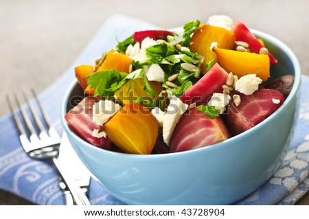 Bowl of roasted sliced red and golden beets
