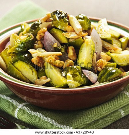 Vegetarian bowl of roasted brussel sprouts with walnuts