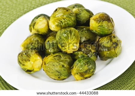 Plate of roasted green brussels sprouts on placemat