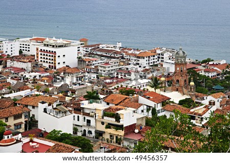 Cityscape view from above with church and Pacific ocean in Puerto Vallarta, Mexico