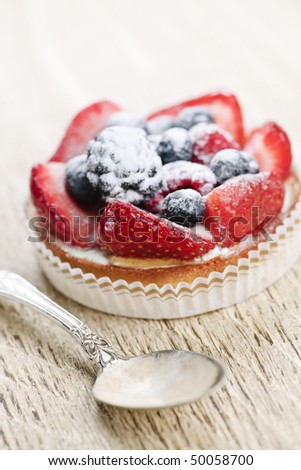 Fancy gourmet fresh fruit dessert tart with spoon