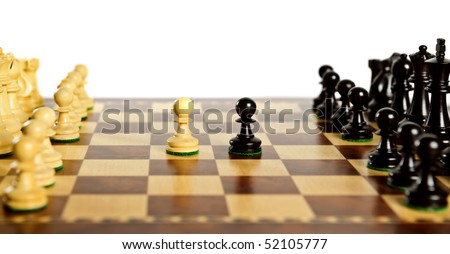 Close up of chess pieces on wooden chessboard