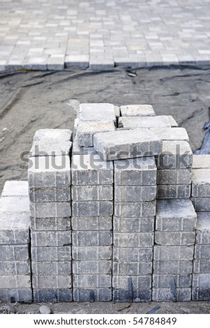 Stacks of interlocking stones for installing driveway landscaping