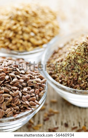 Bowls of whole and ground flax seed or linseed
