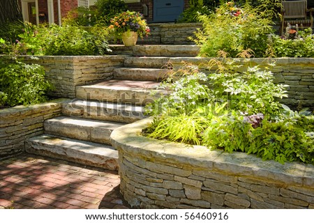 Natural stone landscaping in home garden with stairs