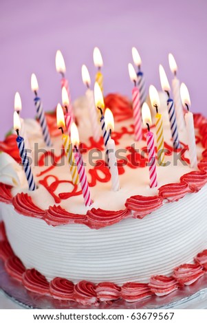 Birthday Cake  Candles on Birthday Cake With Burning Candles And Icing On Pink Background Stock