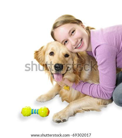 stock photo Teenage girl hugging golden retriever pet dog isolated on 