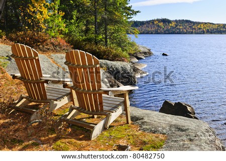 Adirondack chairs at shore of  Lake of Two Rivers, Ontario, Canada