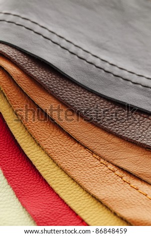 Natural leather upholstery samples with stitching in various colors