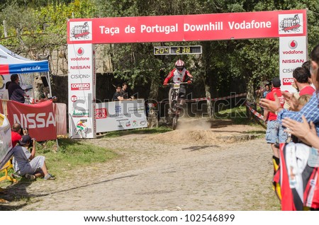 VIANA DO CASTELO, PORTUGAL - MAY 13: Joao Gois crossing the finish line on the 4th Stage of the Taca de Portugal Downhill Vodafone on may 13, 2012 in Viana do Castelo, Portugal.