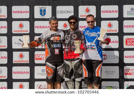VIANA DO CASTELO, PORTUGAL - MAY 13: Master 40 winner Joao Estevao in the middle at the podium on the 4th Stage of the Taca de Portugal Downhill Vodafone on may 13, 2012 in Viana do Castelo, Portugal.