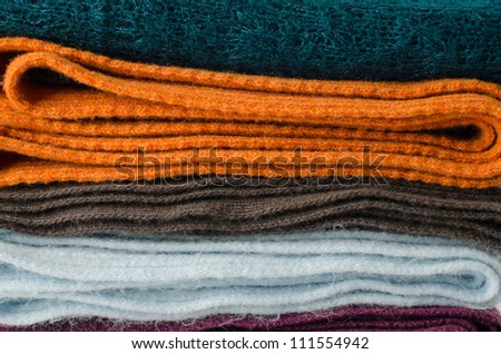 Pile of colorful scarves, can work as a background.