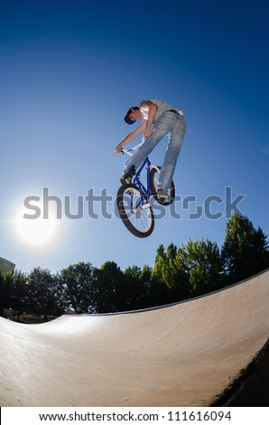 High BMX jump in a skate park.