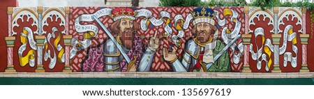 TORDESILLAS - SPAIN SEP 24: A mural painting of King Afonso XI and his son King Pedro I on September 24 2012 in Tordesillas, Spain. Kings ordered to build Santa Claras\' buildings on the XIV century.