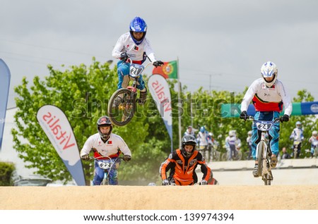 ESTARREJA, PORTUGAL - MAY 26: Fabio Ferreira jumping with style at the 2nd Portugal Bmx Open on may 26, 2013 in Estarreja, Portugal.