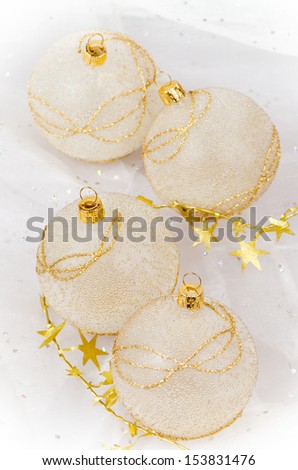 Christmas ball baubles with blue and gold decoration.