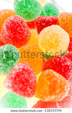 Coloful sweet candies background isolated on white.