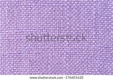 Closeup detail of purple fabric background
