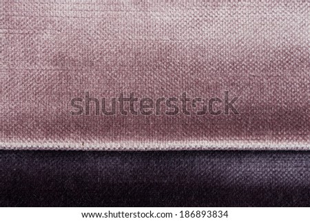Closeup detail of purple fabric texture background.