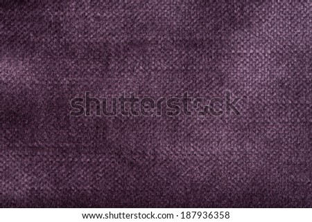 Closeup detail of purple fabric texture background.