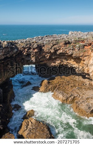 The rocky coastline of Cascais is famous for the cave named, The jaws of the devil or The gates of hell, Portugal.