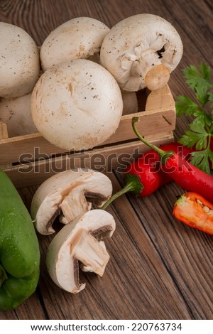Vegetables on wooden box on wooden table background