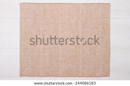 Place mat on wooden deck table.