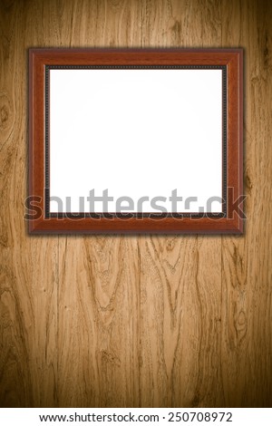 Photo or painting frame on wooden background.