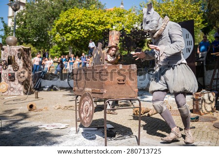 FEIRA, PORTUGAL - MAY 23, 2015: The Lost Wheels of Time performed by Serious Clowns from United Kingdom, Germany and Austria during the Imaginarius 2015 festival.