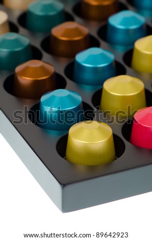 Coffee capsules for a coffee machine, close up view isolated on white background.