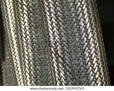 tubes / Woven metal sheath on electrical conduits.