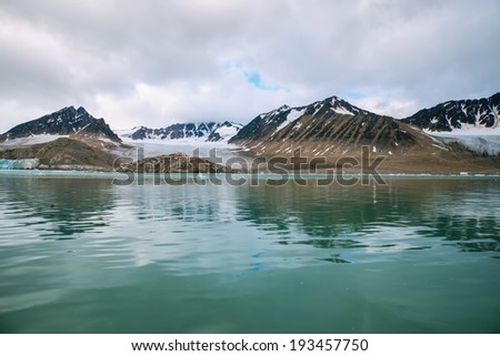 arctic mountains, glacier and cove in svalbard norway