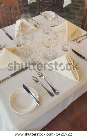 fine dining white linen table setting