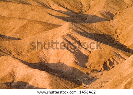 late day shadows across the desolate grapevine mountains in death valley, california